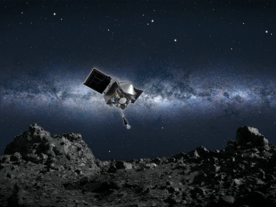 a spacecraft hovering over a rocky asteroid